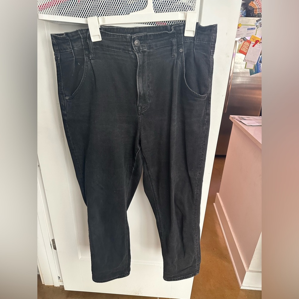 AE paper bag waist black denim jeans. Small stain right front pocket (pictured)